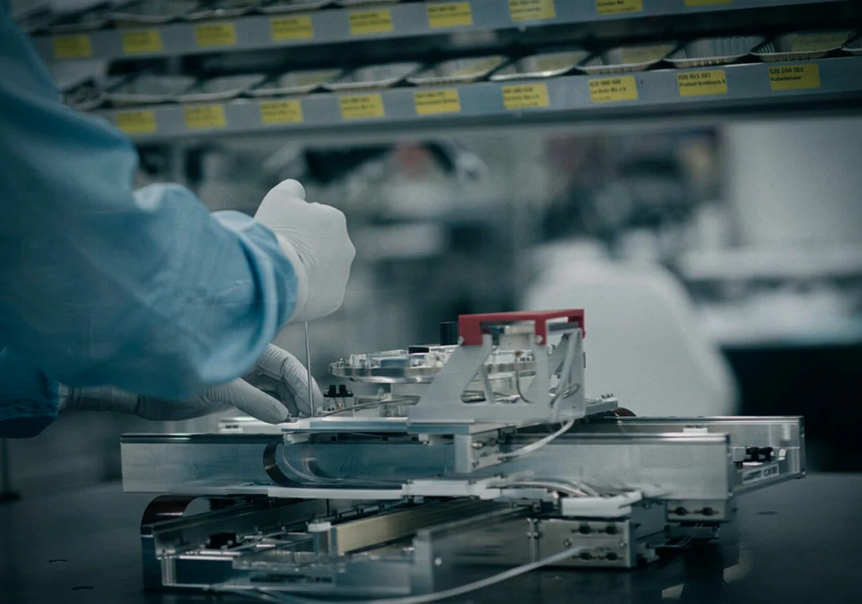 Not Just Engineering: Focus on Serial Production — cleanroom assembly with gloved hands